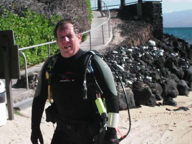 Mark F Gremillion in scuba gear on a Hawaiian shore